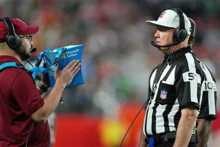 Why do NFL Refs throw their hats